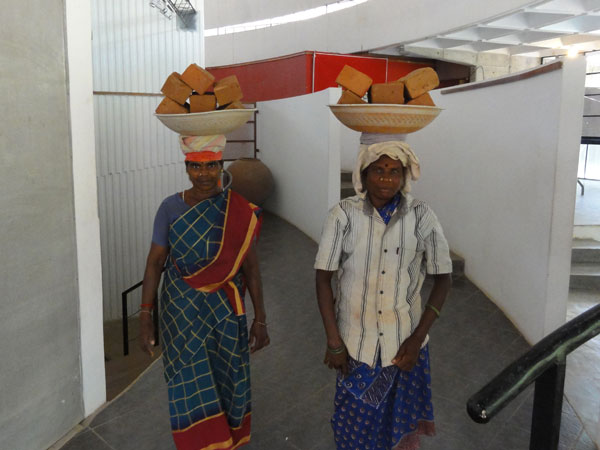Women carrying bricks, Auroville